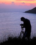Man photographing sunset